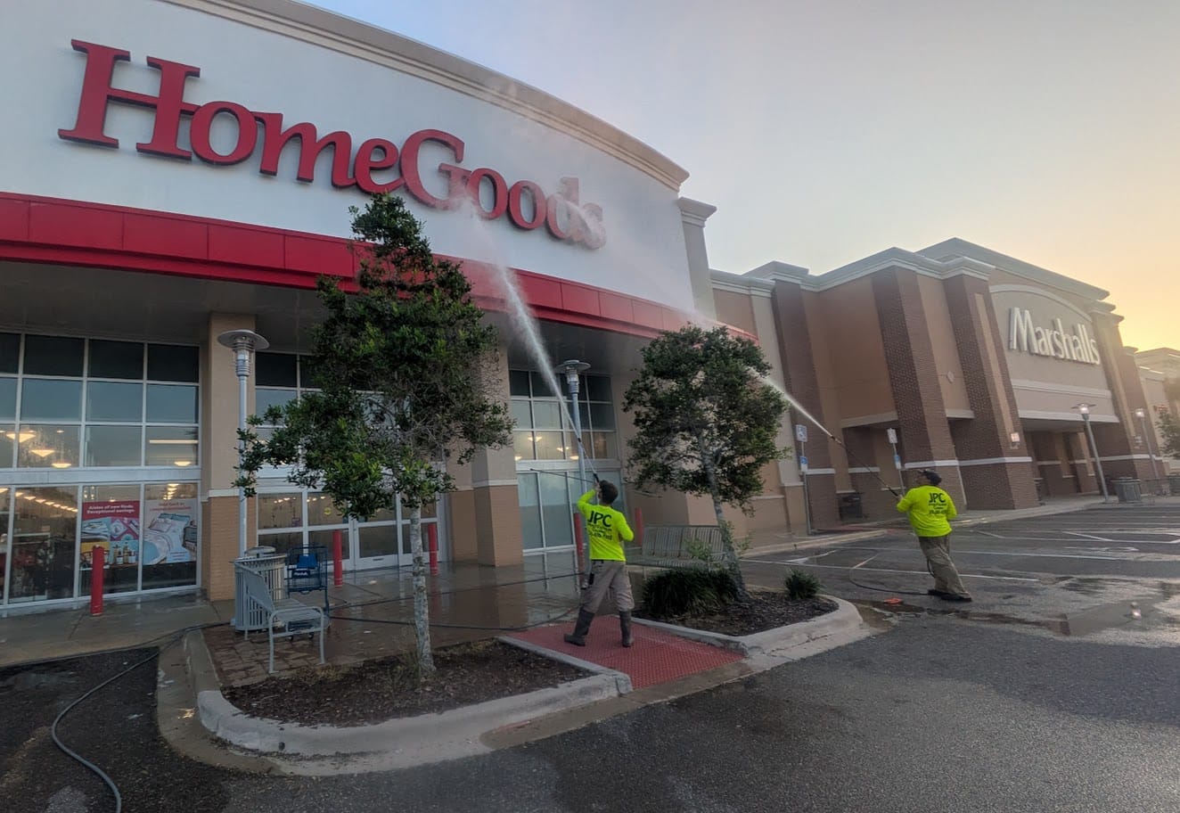 Two JPC technicians washing the HomeGoods and Marshalls storefronts at Hammock Landing in Palm Bay, FL