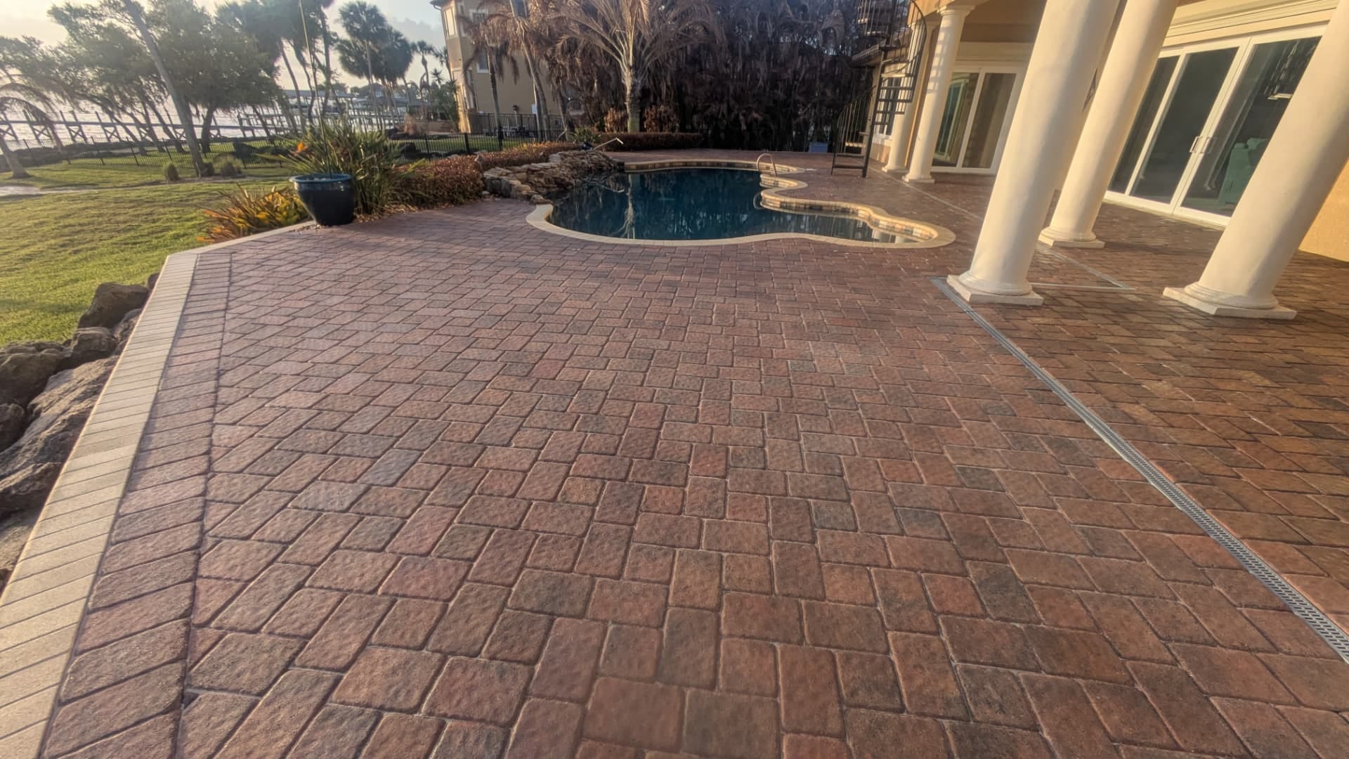 Restored and sealed brick paver pool deck at a riverfront estate in Rockledge, FL