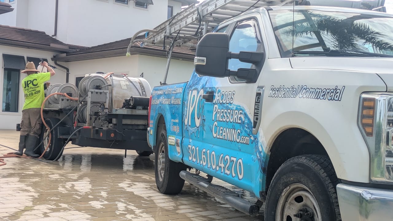 Close-up of the JPC truck and trailer rig during a house wash in Viera, FL