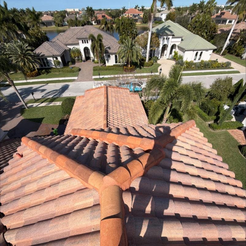 View across the freshly cleaned tile roof of a Viera, FL estate with the surrounding neighborhood