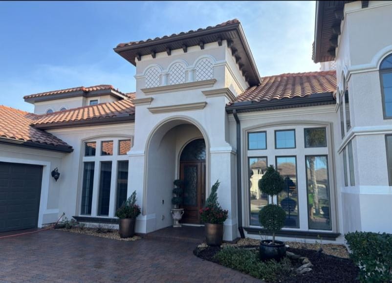 Viera, FL estate home with its tile roof freshly soft washed by Jacobs Pressure Cleaning